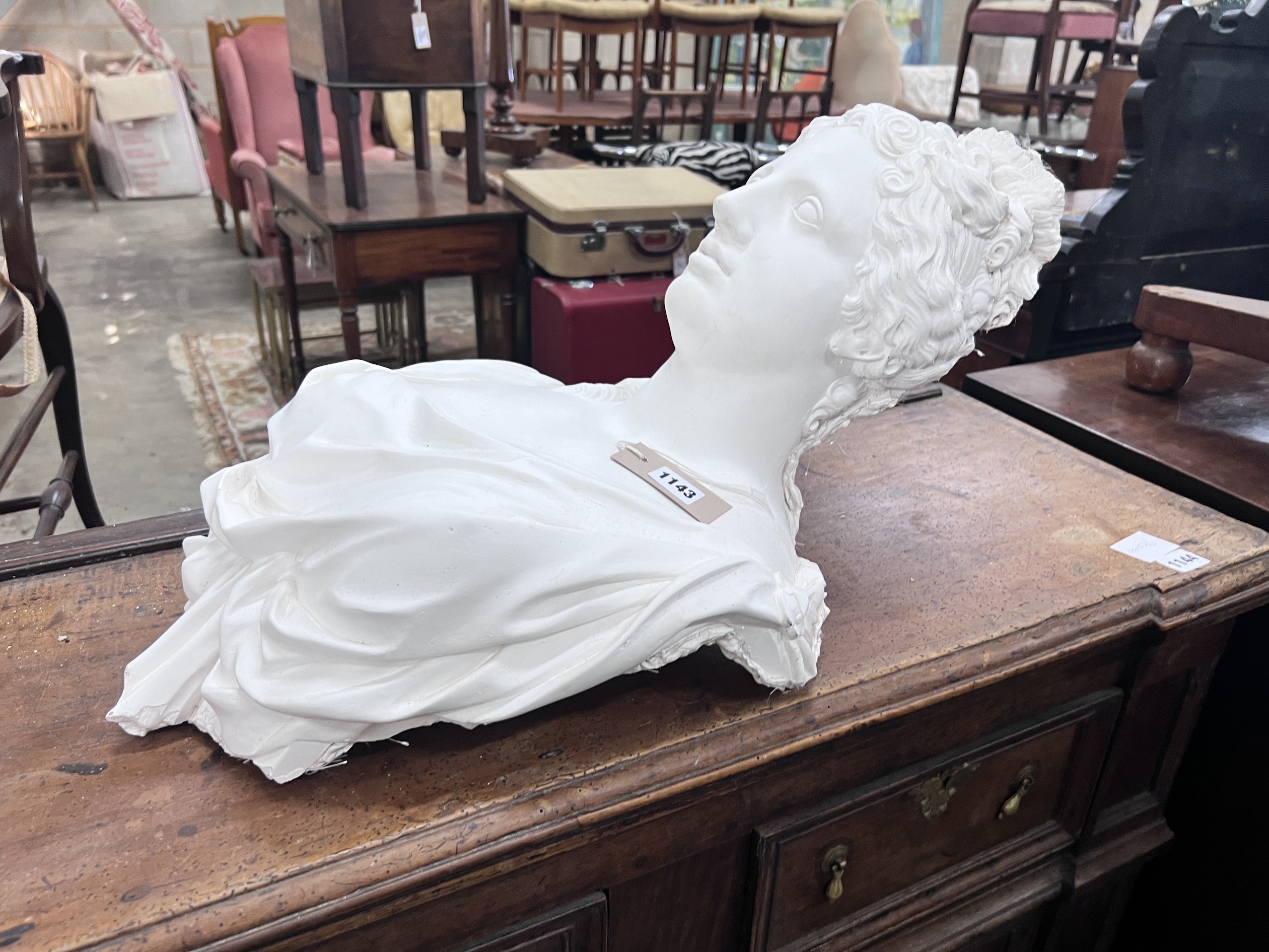 Two cast plaster wall applique busts, width 36cm, height 64cm